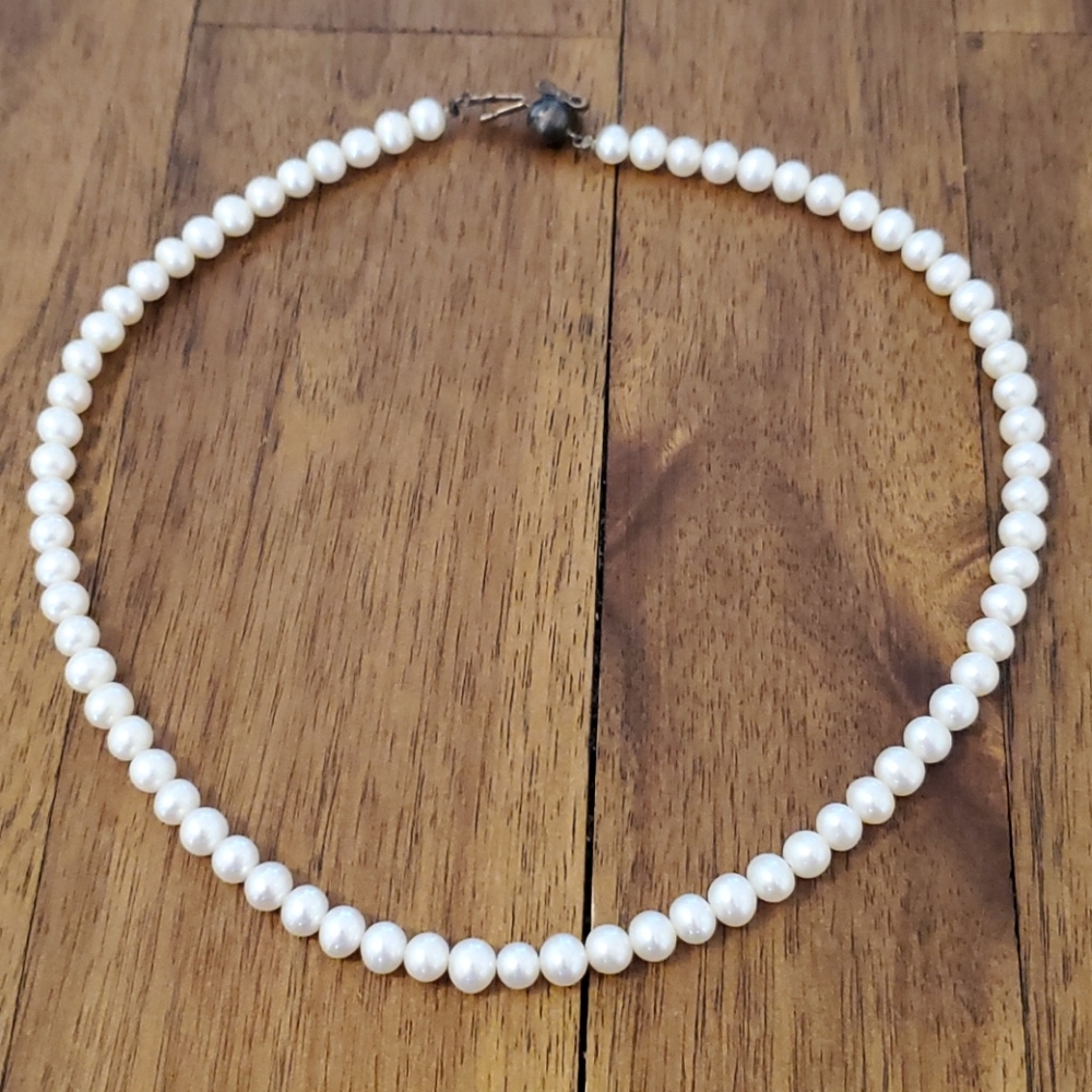 Little girl string of pearls